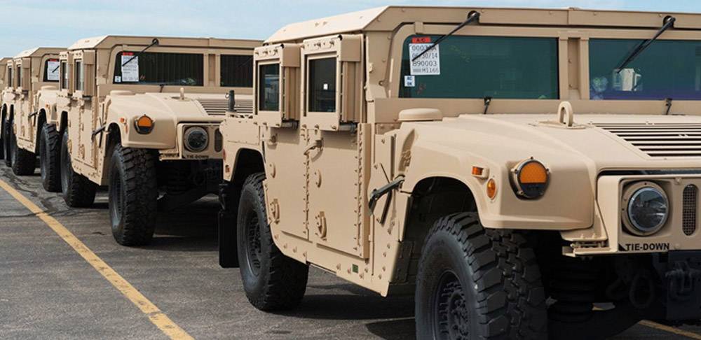 Line of milltary vehicles symbolizes custom machining for military by Lange Grinding and Machining near Akron Ohio